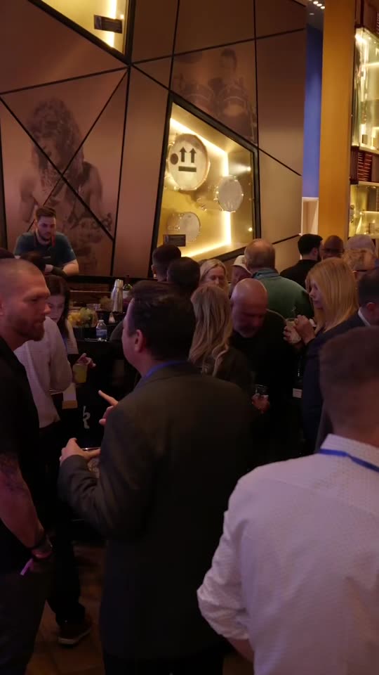 Agents talking in small groups at the welcome reception