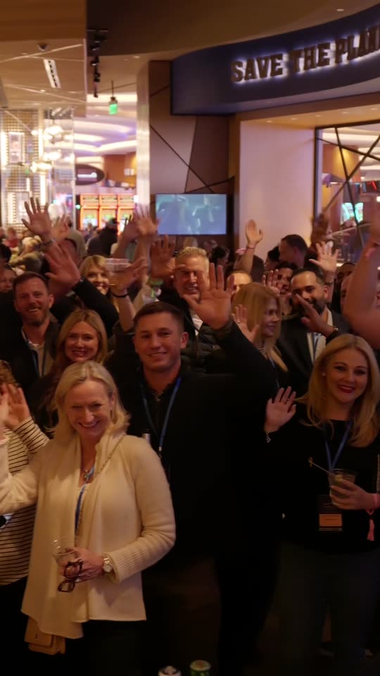 The full room waving at the camera